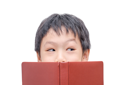 happy boy reading book